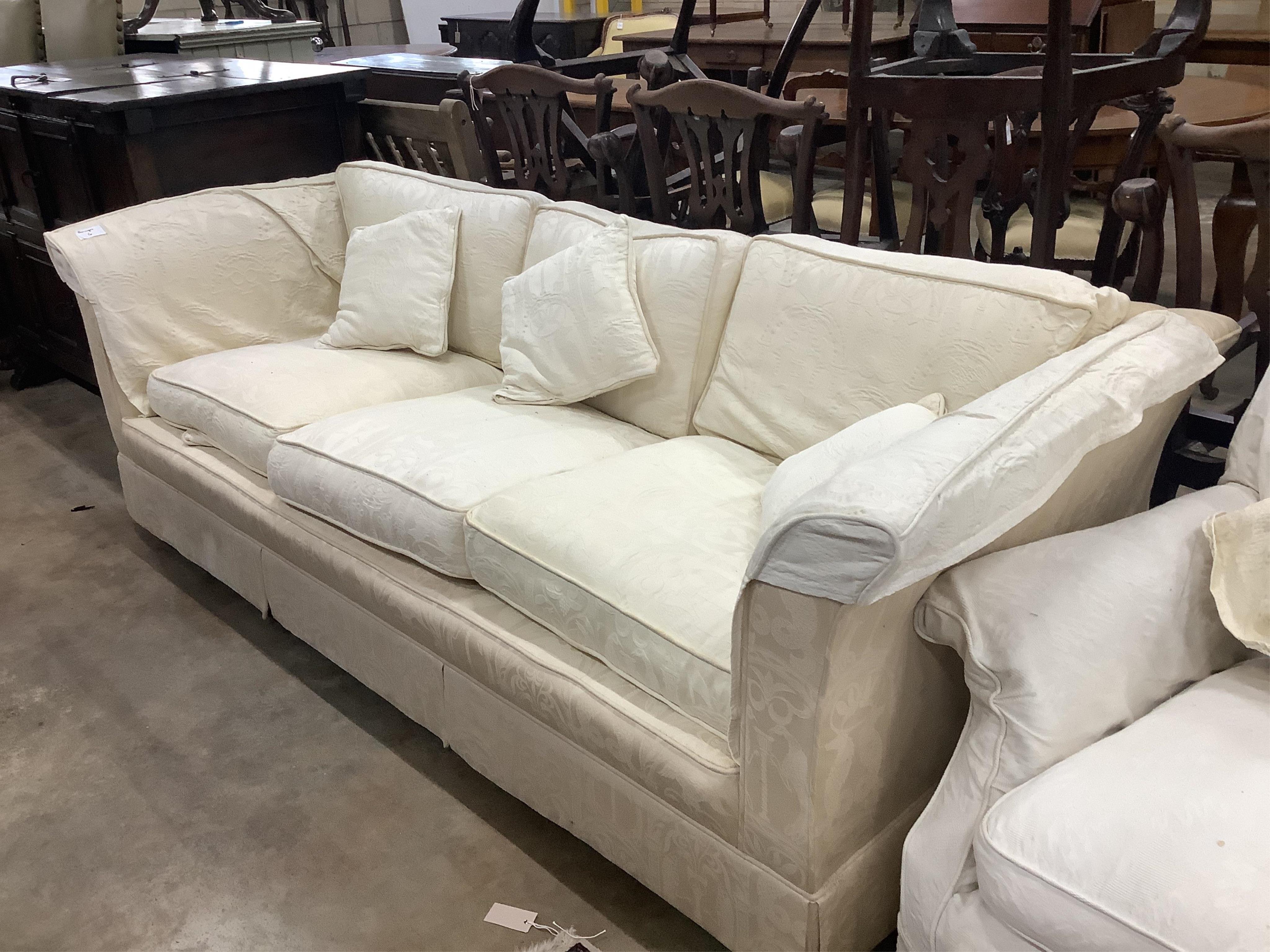 A pair of cream brocade upholstered three seater chesterfield settees, width 224cm, depth 91cm, height 72cm, and a matching lounge armchair. Condition - poor